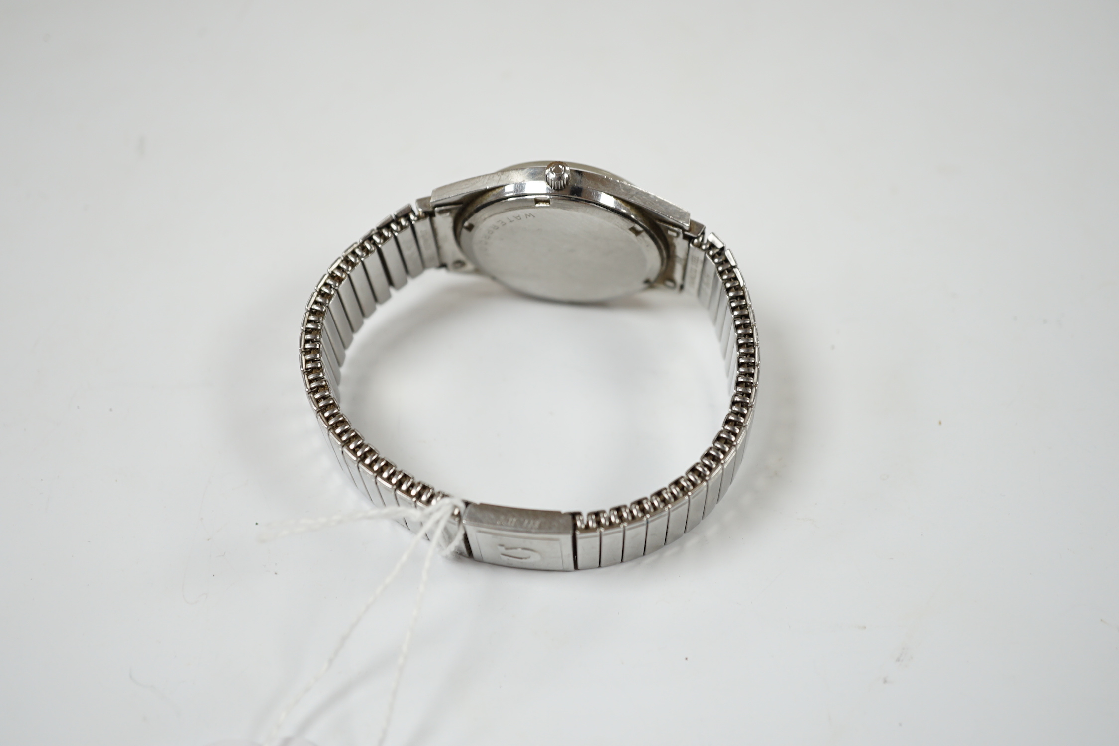 A gentleman's stainless steel Omega manual wind wrist watch, with date aperture, on associated flexible strap, case diameter 35mm, no box or papers.